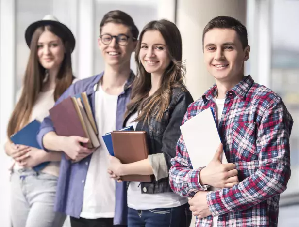 group-of-happy-young-students-in-university