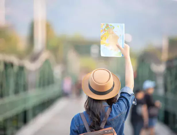 female-tourists-hand-have-happy-travel-map